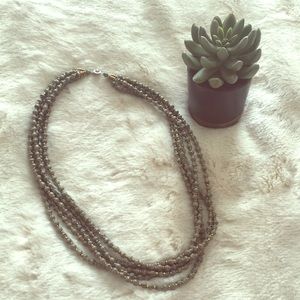 31 bits grey and gold necklace